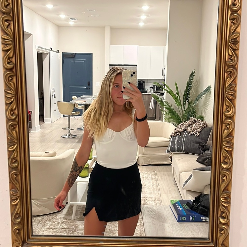 Black mini skirt with slit